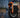 Kingsong S16 Pro electric unicycle in a modern city plaza at blue hour with open space on the left for editorial title treatment