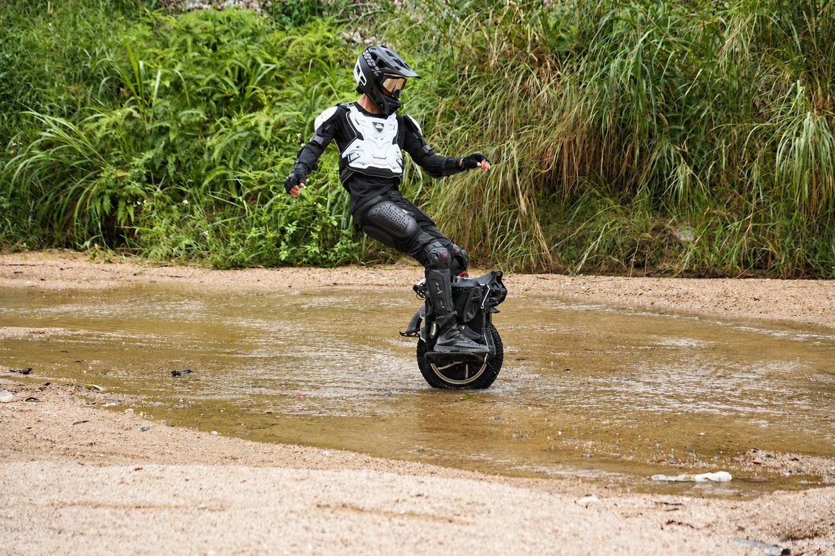 Electric unicycle rider on a forest road