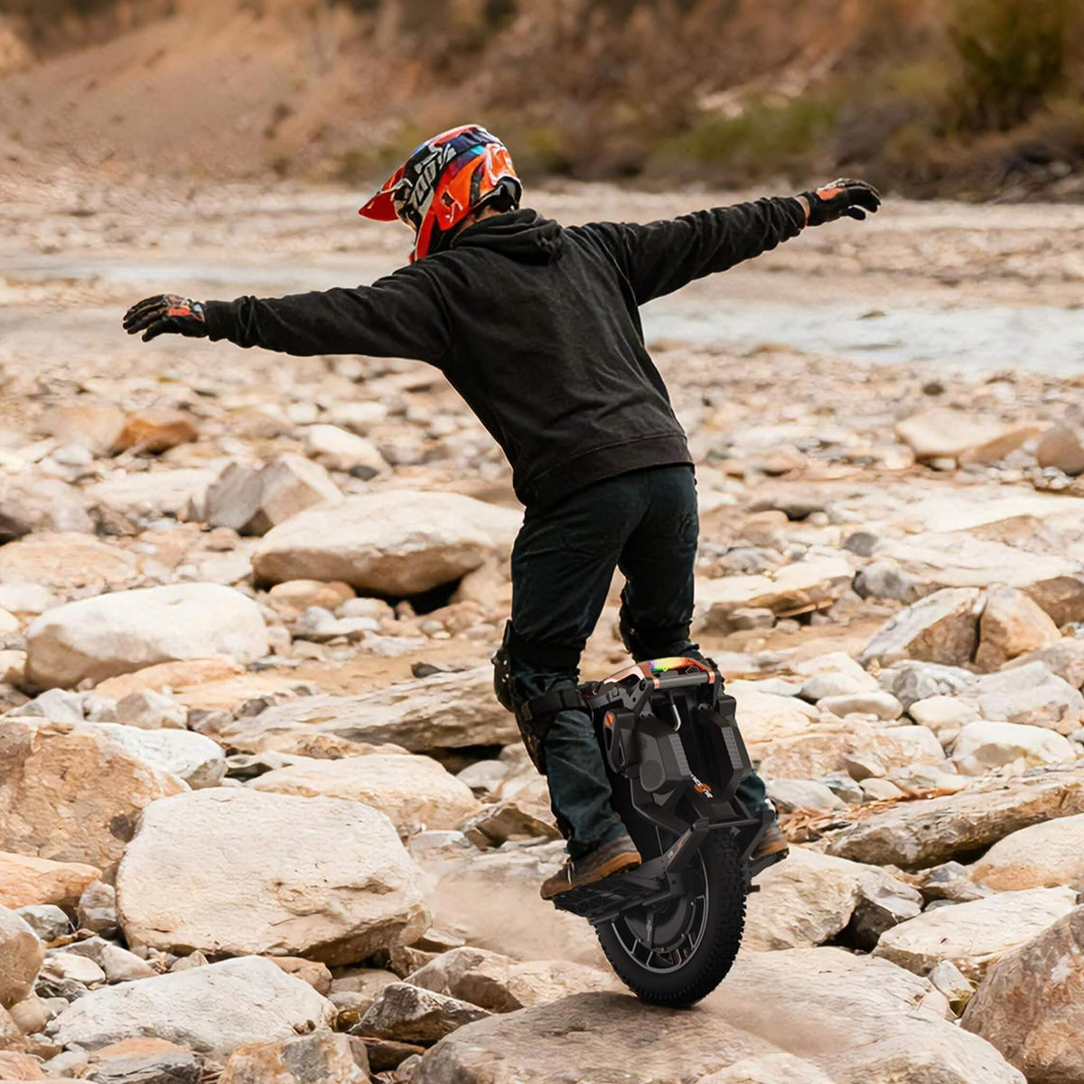 KingSong F18 race rider controlling the wheel through rough terrain