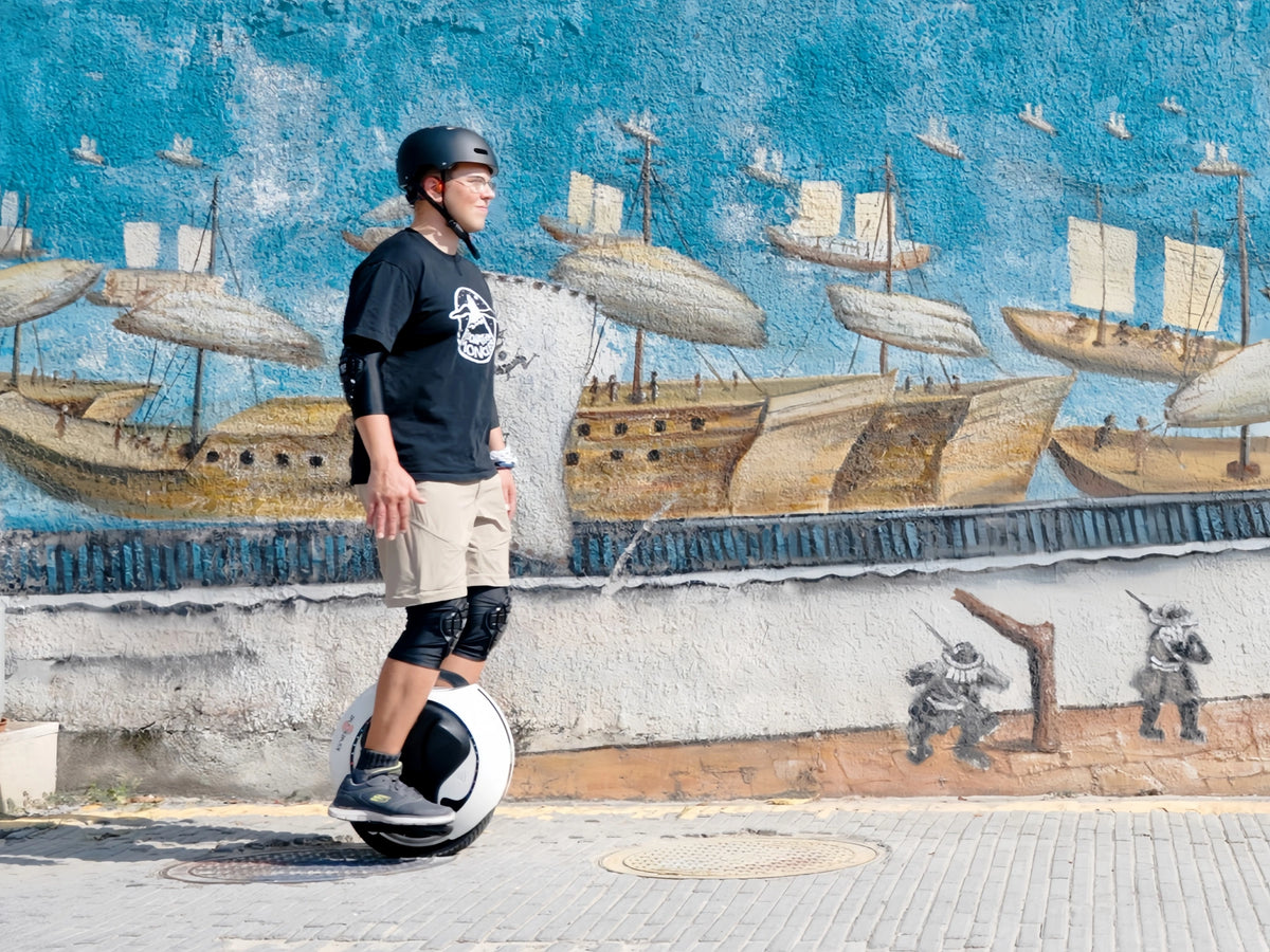 Electric unicycle rider looking forward while riding